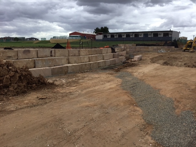 Boulevard sandstone log retaining wall under construction