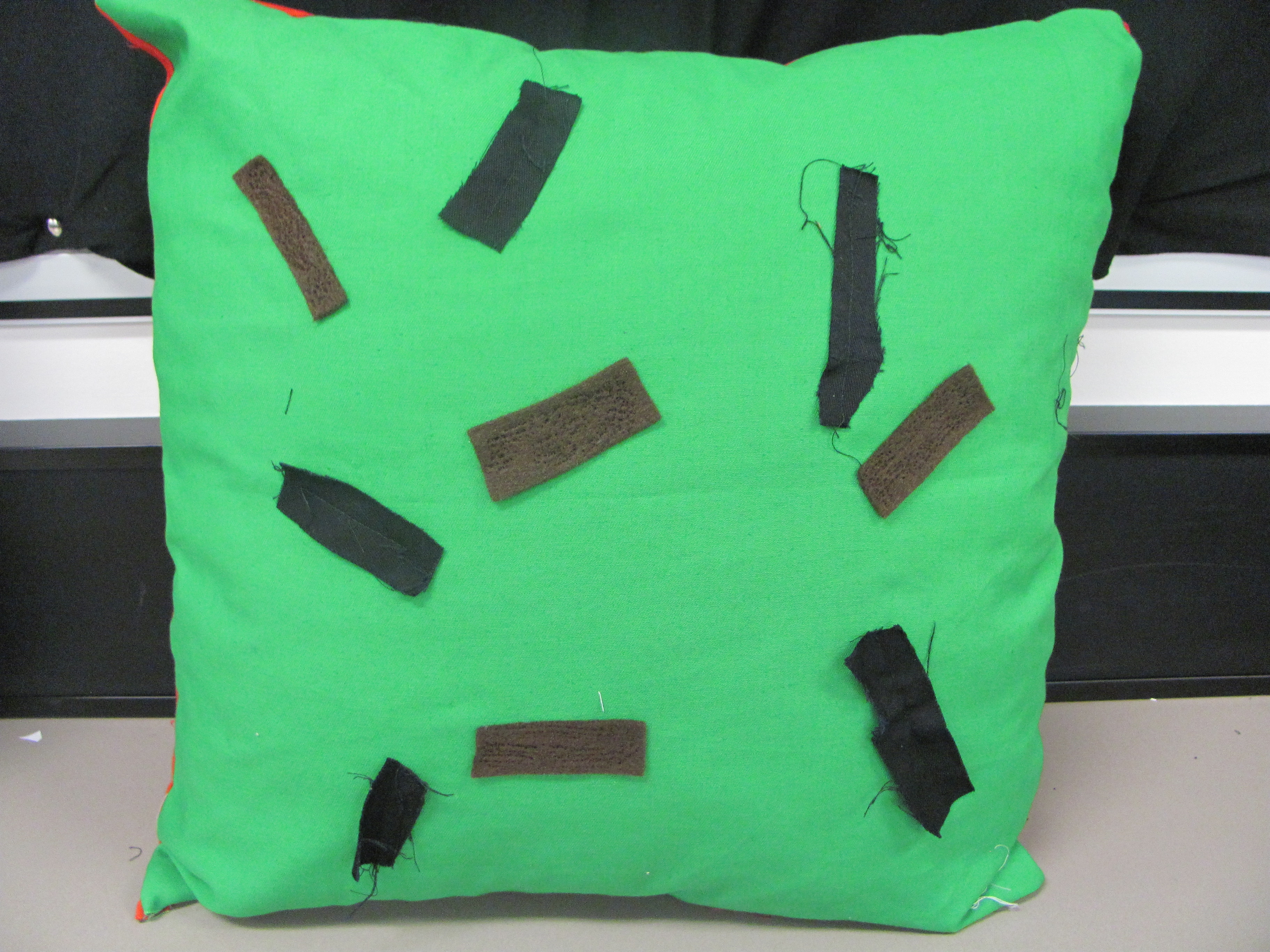 Green and black cushion Textile Technology