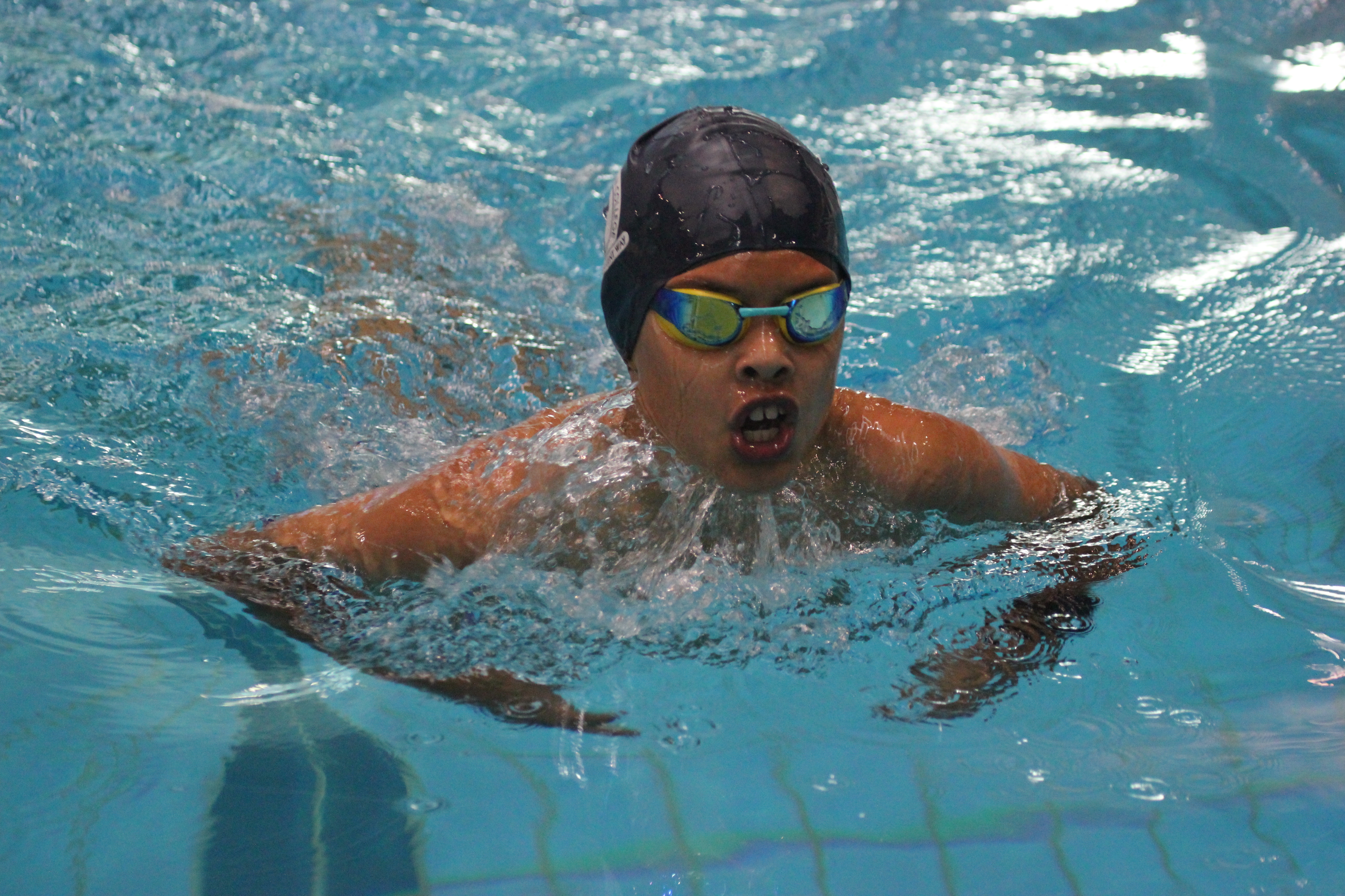 Boy swimming breaststroke