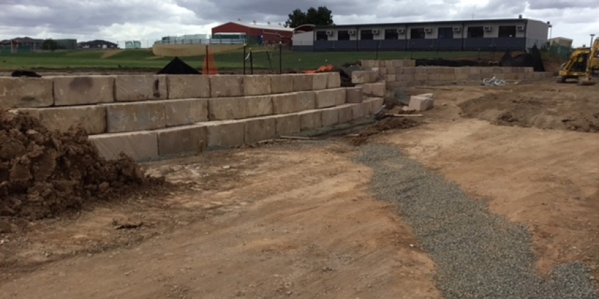 Boulevard sandstone log retaining wall under construction