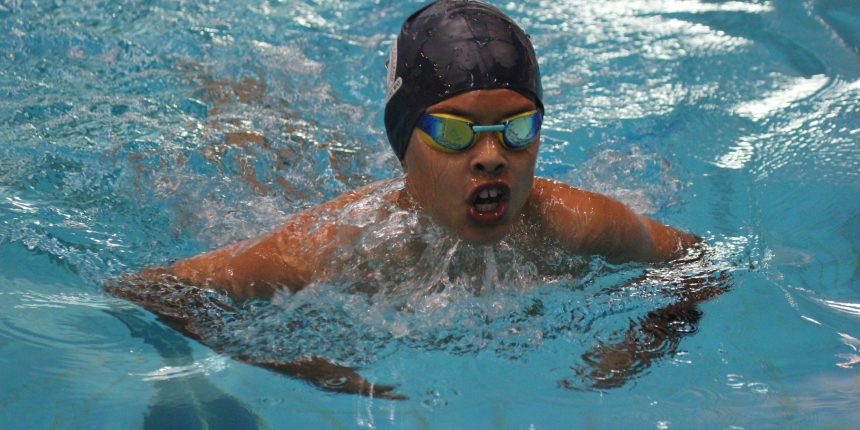 Boy swimming breaststroke