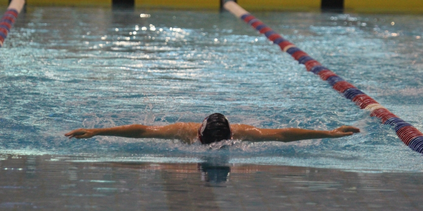 Boy swimming butterfly