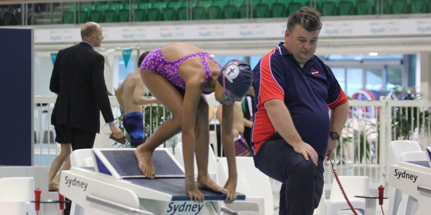 girl swimming diving relay